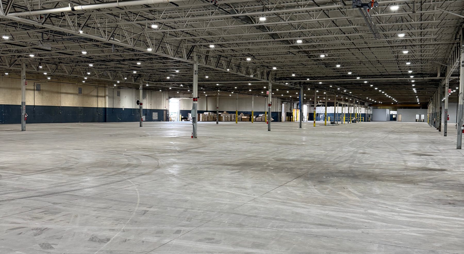 The empty warehouse floor of the new FixMyToys distribution center in Romeo, Michigan
